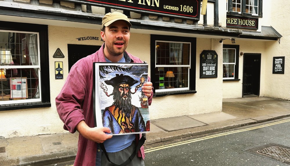 Blackbeard to Banksy Tour guide Owen, Showing a picture of Blackbeard on a Bristol Walking Tour