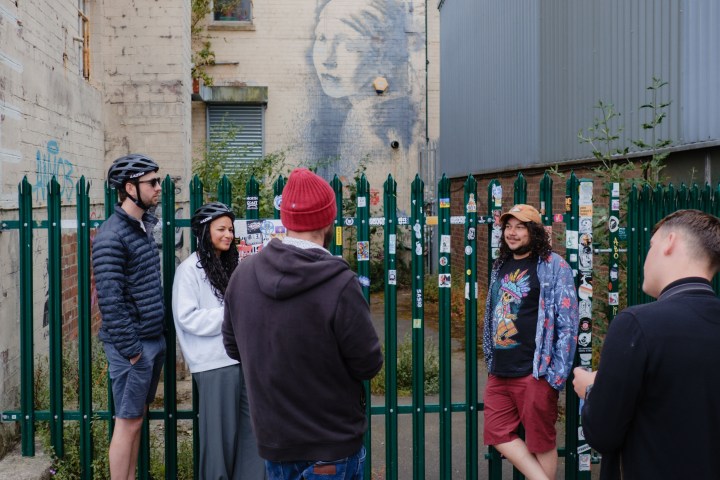 a group of people standing in front of a building